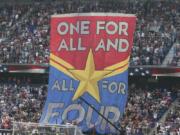 FILE- In this Sunday, May 26, 2019, file photo, fans hold up a banner in support of the United States women’s national team before they compete in the Women’s World Cup during an international friendly soccer match between the United States and Mexico in Harrison, N.J. The World Cup is not just about soccer for many of the players and teams in France. For the defending champion U.S.