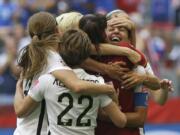 United States’ Carli Lloyd, right, celebrates with teammates during the 2015 championship match. The U.S. national team, ranked No. 1 globally, will try to defend its title in soccer’s premier tournament, which kicks off on June 7.