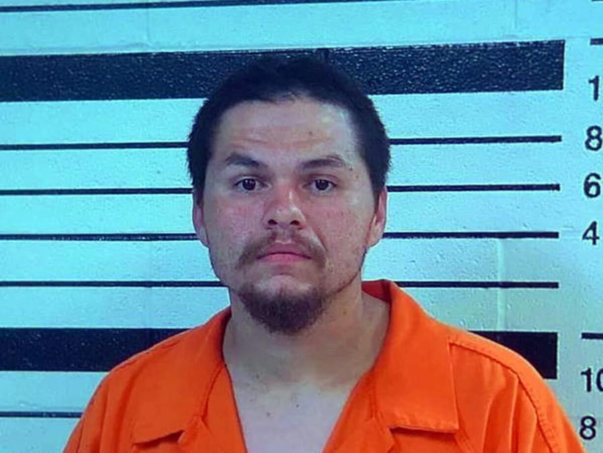 This booking image provided by the Yakama Nation shows James Cloud, who was charged along with Donovan Quinn Carter Cloud, with assault with a deadly weapon, for actions related to pointing a gun at a child. According to court documents filed in U.S. District Court in Yakima, Wash., they were identified by witnesses as having shot and killed several people on Saturday, June 8, 2016, the documents state. However, it was unclear if they would be charged with the killings.