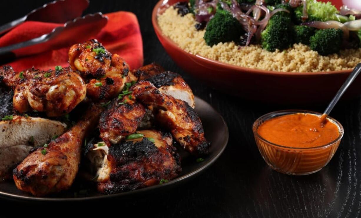 Grilled chicken with harissa sauce and couscous, prepared and styled by Shannon Kinsella, in the test kitchen,.