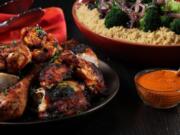 Grilled chicken with harissa sauce and couscous, prepared and styled by Shannon Kinsella, in the test kitchen,.