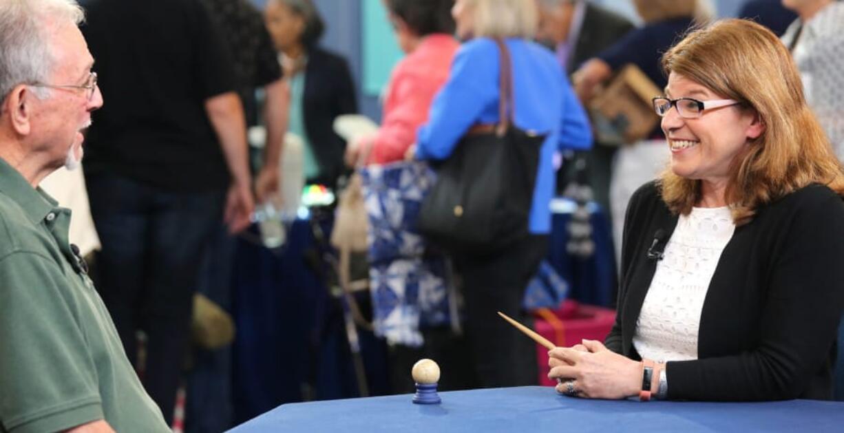 Leila Dunbar, well-known appraiser on PBS’ “Antiques Roadshow,” evaluates a treasure. The show will specialize in space collectibles when it airs its “Out of This World” event on July 8.