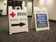 Signs leading to an American Red Cross blood and bone marrow drive are seen at The Nines hotel in Portland in 2017.