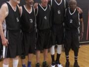 Battle Ground’s Jim Nielsen, center, stands with his teammates during the National Senior Games last month in Albuquerque, N.M.