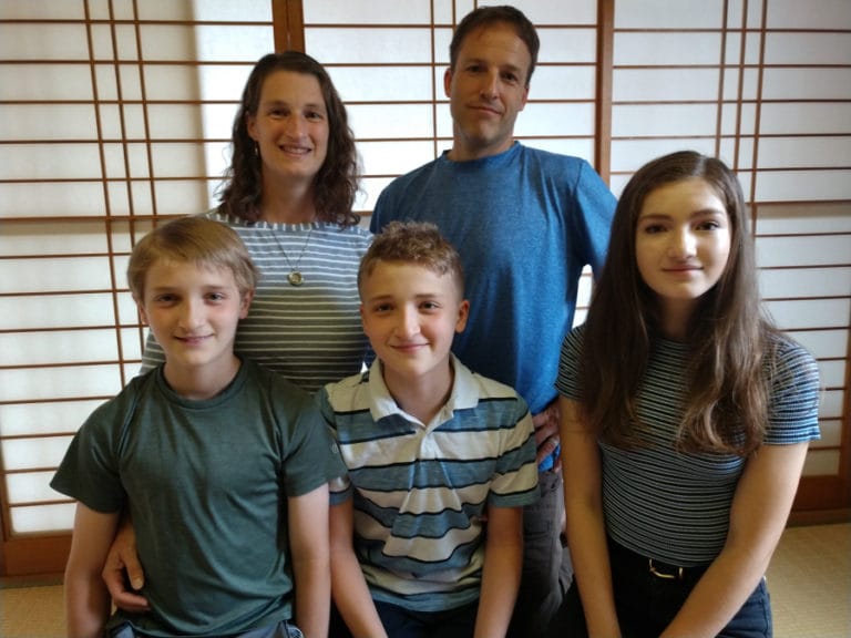 Thomas Keen Cunningham, center front, poses next to his brother Zane and sister Bailey with their parents, Becca Keen Cunningham and Jason Cunningham. The family advocates for window safety after Thomas fell out of a second-story window in their home almost a decade ago.