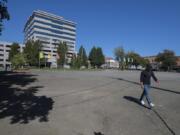 Anthony Ringering of Vancouver strolls across Block 10 in downtown Vancouver. The block is slated to be redeveloped by Holland Partner Group.