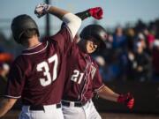 Rifgefield’s Steve Ramirez, right, celebrates scoring against the Port Angeles Lefties at the Ridgefield Outdoor Recreation Complex on Friday night, June 14, 2019.