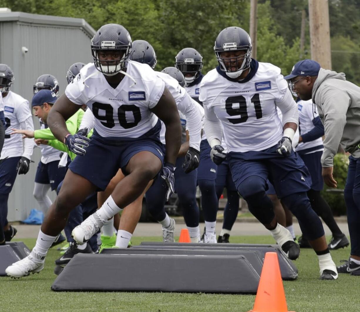 Ted S. Warren/Associated Press Seattle Seahawks defensive tackle Jarran Reed (90) will miss the first six games of the 2019 NFL season after being suspended on Monday.