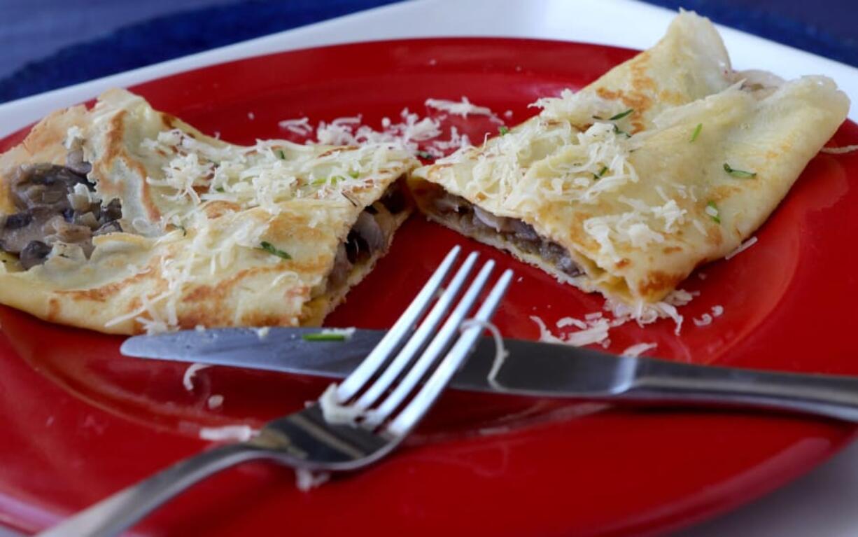 French crepe filled with mushrooms, shallots and cheese. Hillary Levin/St.