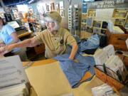 Kathryn Mills, 89, waves goodbye to a customer during a volunteer shift this month at the Trail Mix store in Peninsula, Ohio.