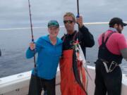 A happy angler proudly displayes the first tuna of the year for Shake and Bake Tuna Charters of Ilwaco, WA. The schools of albacore are finally within range of the Washington Coast.