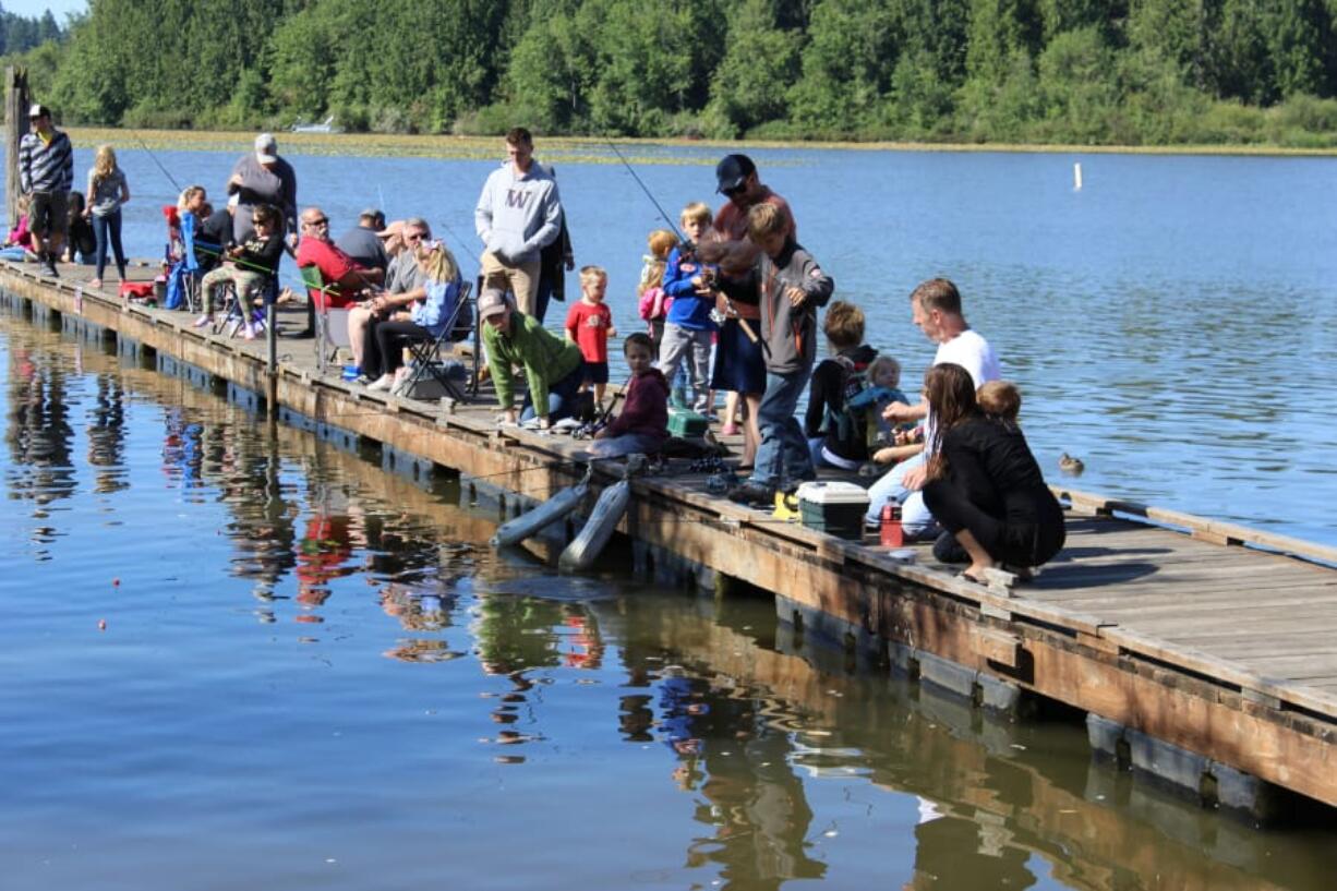 Kids and parents enjoy the first annual Kids Fishing Derby held at Streeter's Resort along the banks of Silver Lake this last Saturday. 35 kids took part, catching over 40 panfish.