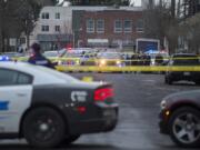 Crime scene tape and police vehicles are visible at the scene of a fatal officer-involved shooting Feb. 28 near the intersection of West 12th and Jefferson streets west of downtown Vancouver. The Clark County Prosecuting Attorney’s Office has found that two Vancouver police officers were justified in using deadly force against 29-year-old Michael Eugene Pierce, a mentally ill homeless man who was brandishing realistic replica handguns.