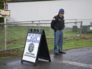 A Washington State Patrol officer mans a checkpoint at a Battle Ground School District school in October 2017, looking for drivers with out-of-state license plates.