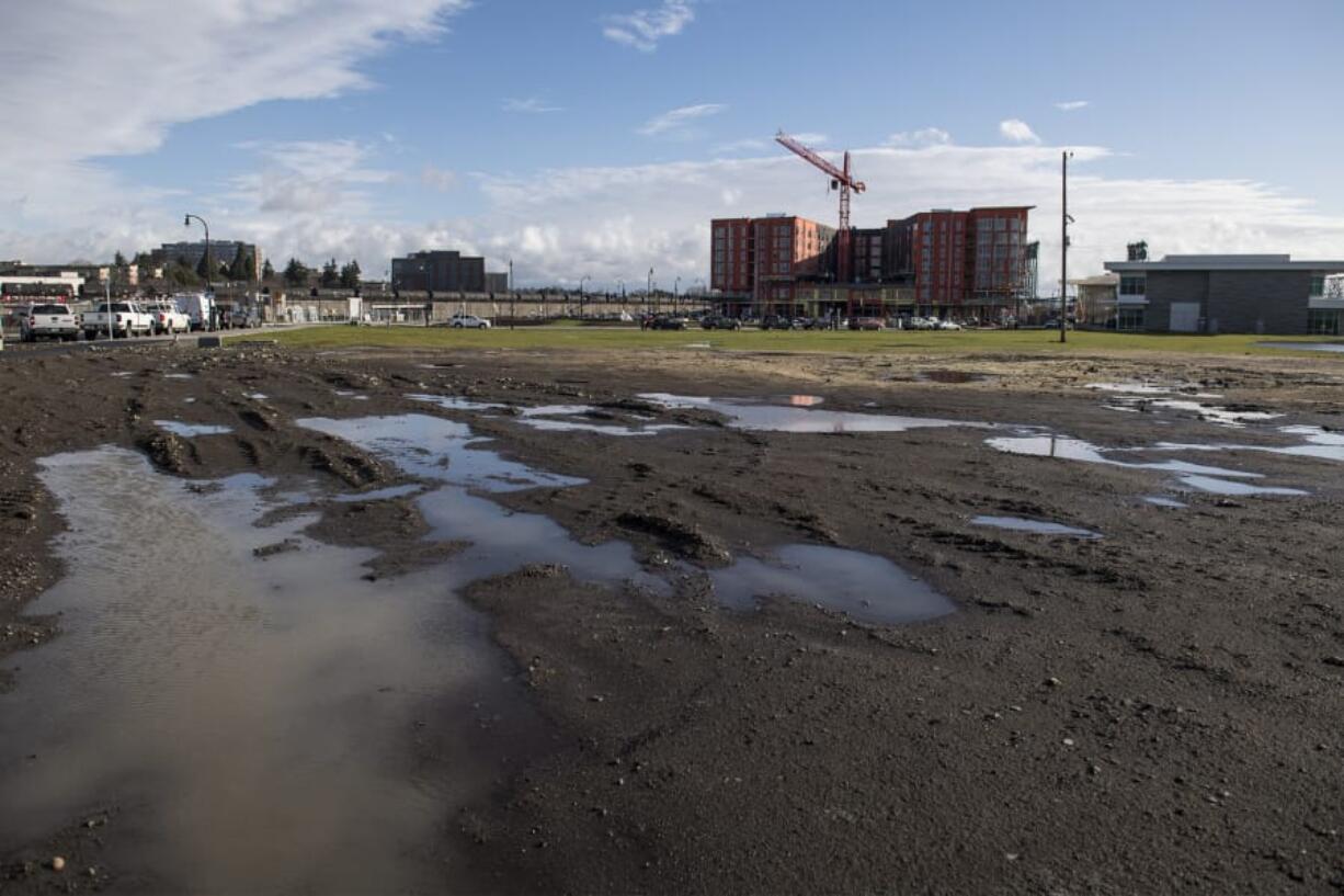 Blocks 20 and 18 are adjacent and are currently a single undeveloped field, but they will eventually be divided by a pedestrian path. Block 20 is seen in the foreground of this picture, with Block 18 behind it. A 200-unit senior housing tower is in the works for Block 18.