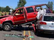 A Chevy Suburban landed partially on top of a Volkswagen SUV on Sunday afternoon on Northwest Erwin O. Rieger Memorial Highway and Northwest Lower River Road.