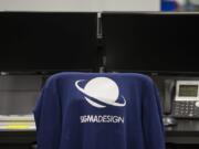 A company sweatshirt is seen on the chair of an employee at Sigma Design.