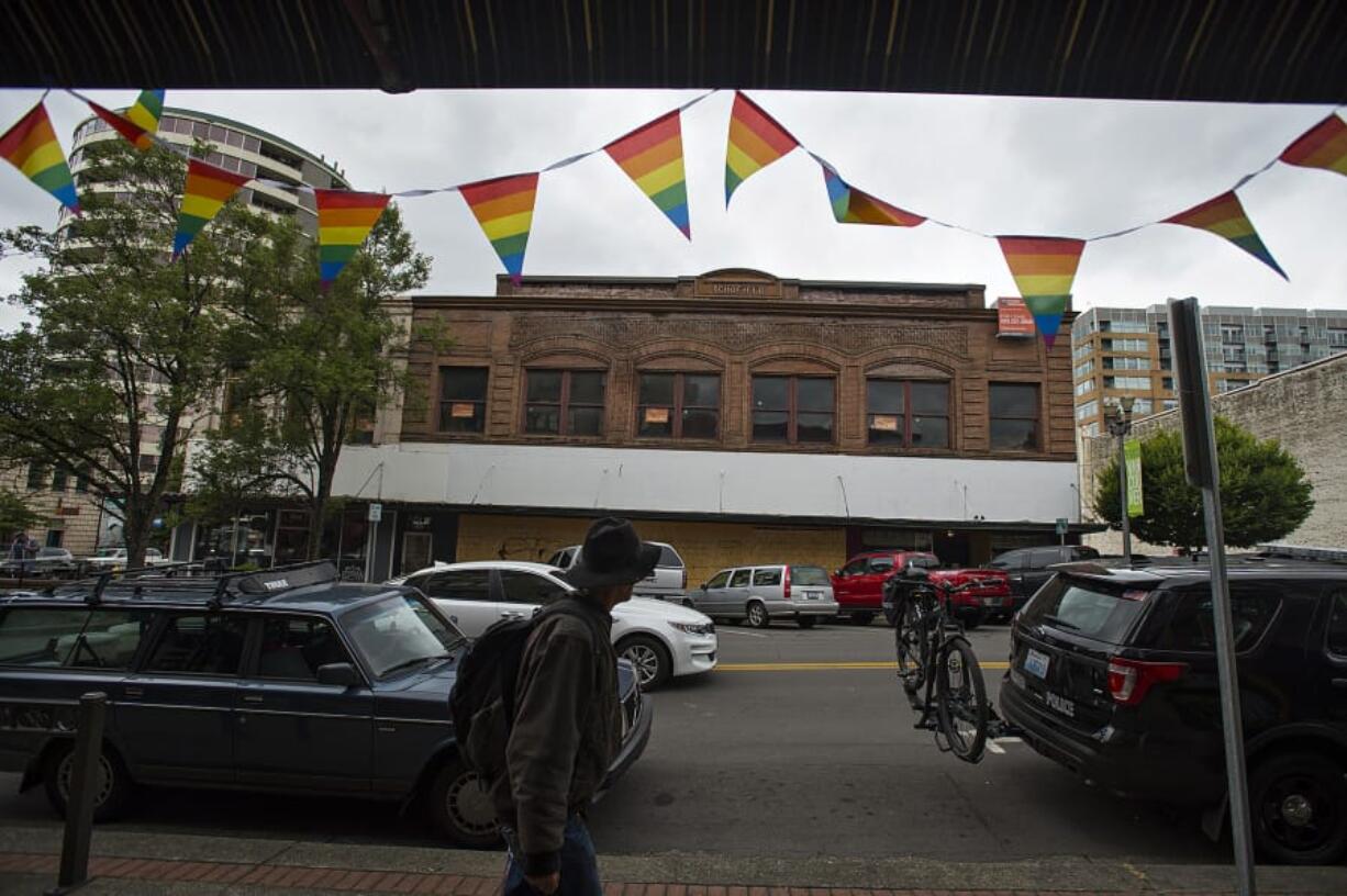 A pedestrian passes by the old Schofield building at 602 Main Street in downtown Vancouver, which may soon be remodeled, as seen Wednesday morning, July 17, 2019.