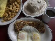 A jalapeno-and-mushroom omelette with toast and fried potatoes, clockwise from left, biscuits and gravy and the two-egg breakfast with hash browns at Christine’s.