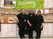 East Vancouver: Chartwells staff, from left, Stacy Struck, Katie Rasmussen and Abida Murtaza brought radishes to Burton Elementary School, which played host to the Harvest of the Month program recently.