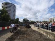 A crowd of onlookers watched Thursday morning as the ceremonial first shovelfuls of dirt were turned over for the fourth tower of the Vancouvercenter.