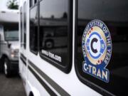 C-Tran pastes new stickers to celebrate their recent award on their buses during a special event at the C-Tran offices in Vancouver on July 9, 2019. C-Tran revealed that The American Public Transportation Association has selected the company as its Transit System of the Year for 2019.