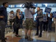 Congressional candidate Carolyn Long gives a television interview following her campaign announcement event at Clark College on Monday night.