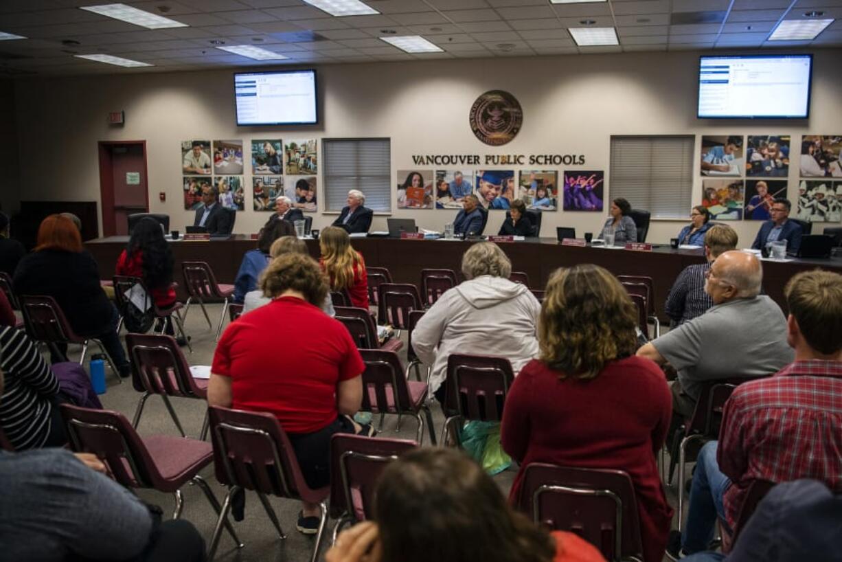 Vancouver Public Schools board members listens to public comment during a Tuesday meeting.