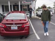 Simon Rommel, 15, left, completes a walk-around of the Wake´s Driving School car before sliding behind the wheel.