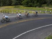 Nathan Howard/The Columbian This year’s Ride Around Clark County, set for July 27, includes a beginner-appropriate, 20-mile, round-trip trek along Lower River Road to Frenchman’s Bar Park. The scenery is beautiful, the road is mercifully flat and there’s a well-stocked rest stop waiting for you at the halfway point. Here, cyclists with the Vancouver Bicycle Club ride the route on a recent Thursday morning.