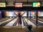 Clinton Cotton of Vancouver celebrates a successful bowl at Allen’s Crosley Lanes. The Vancouver Parks and Recreation department currently offers two bowling sessions a week for people with disabilities but is capping the number of participants allowed at each session.