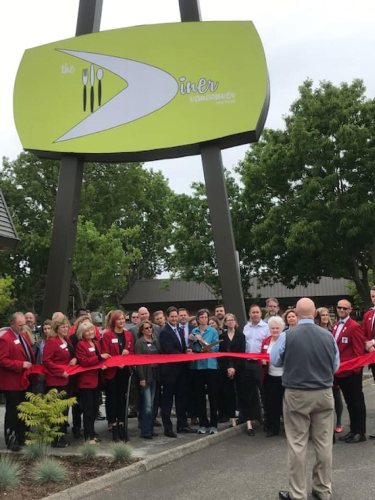 Central Vancouver: David Reiter, senior vice president at Bank of America, and Suzanne Washington, chief executive officer of Meals on Wheels People, cut the ribbon with the Vancouver Chamber of Commerce for The Diner Vancouver’s grand opening.