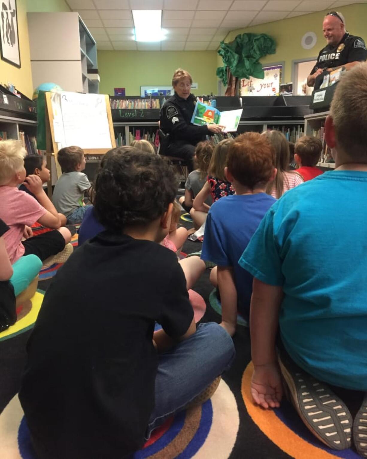 Ridgefield: Officers from the Ridgefield Police Department read to a class at Union Ridge Elementary School, an honor the students earned by showing respect, responsibility and resilience in the library.