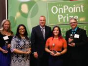 North Salmon Creek: Skyview High School teacher Tori Sharpe was named 9-12 Educator of the Year by OnPoint Community Credit Union. From left is K-8 Educator of the Year finalist Nadia Boria, of Scouters Mountain Elementary School, Happy Valley, Ore.; K-8 Educator of the Year Francesca Aultman, of Gilbert Heights Elementary School, Portland; OnPoint Community Credit Union President and CEO Rob Stuart; Sharpe; and 9-12 Educator of the Year finalist Joe Minato, of Wilson High School, Portland.