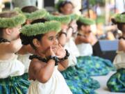 Young dancers perform during a recent Hawaiian festival in Esther Short Park.