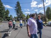 Rick Vanover, left, and Lyn Anderson, talk while out with the Recovery Cafe’s Walking Group.