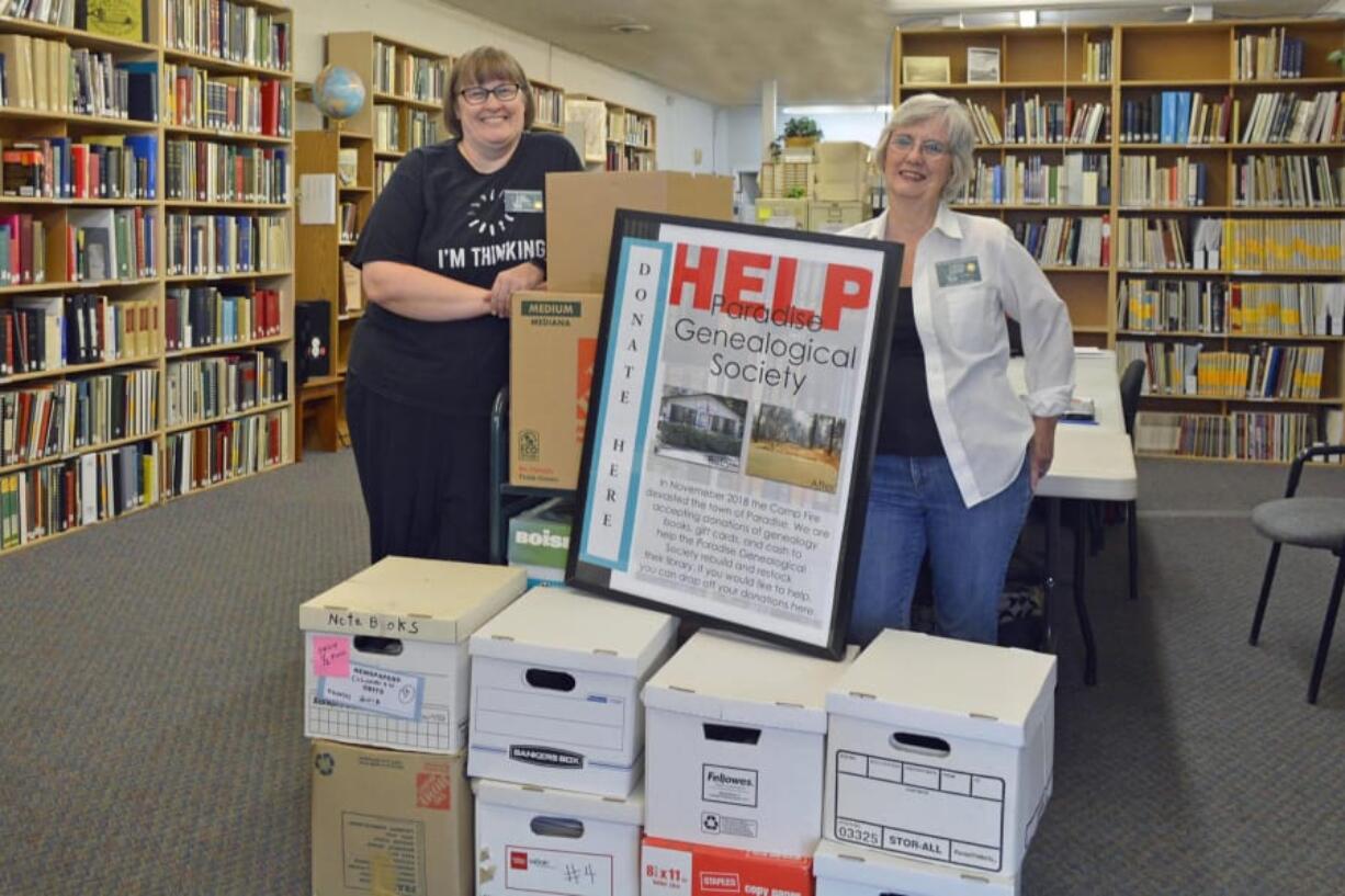 Edgewood Park: Clark County Genealogical Society volunteer librarians Jodi Helton Siewert, left, and Marcia Grubb stand with some of the 13 boxes full of genealogical publications destined for the Paradise Genealogical Society. After the Paradise society’s library burned down in the 2018 wildfire, local genealogical organizations, including the Clark County one, chipped in to send materials so the Paradise group could start building back up their library.