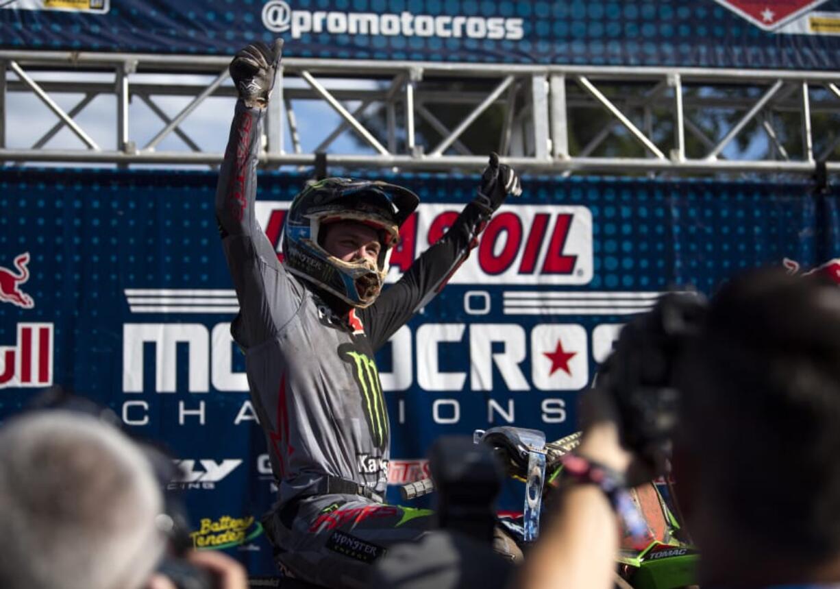 Eli Tomac celebrates on the podium after winning the 450MX race at the Washougal National.