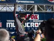 Eli Tomac celebrates on the podium after winning the 450MX race at the Washougal National.