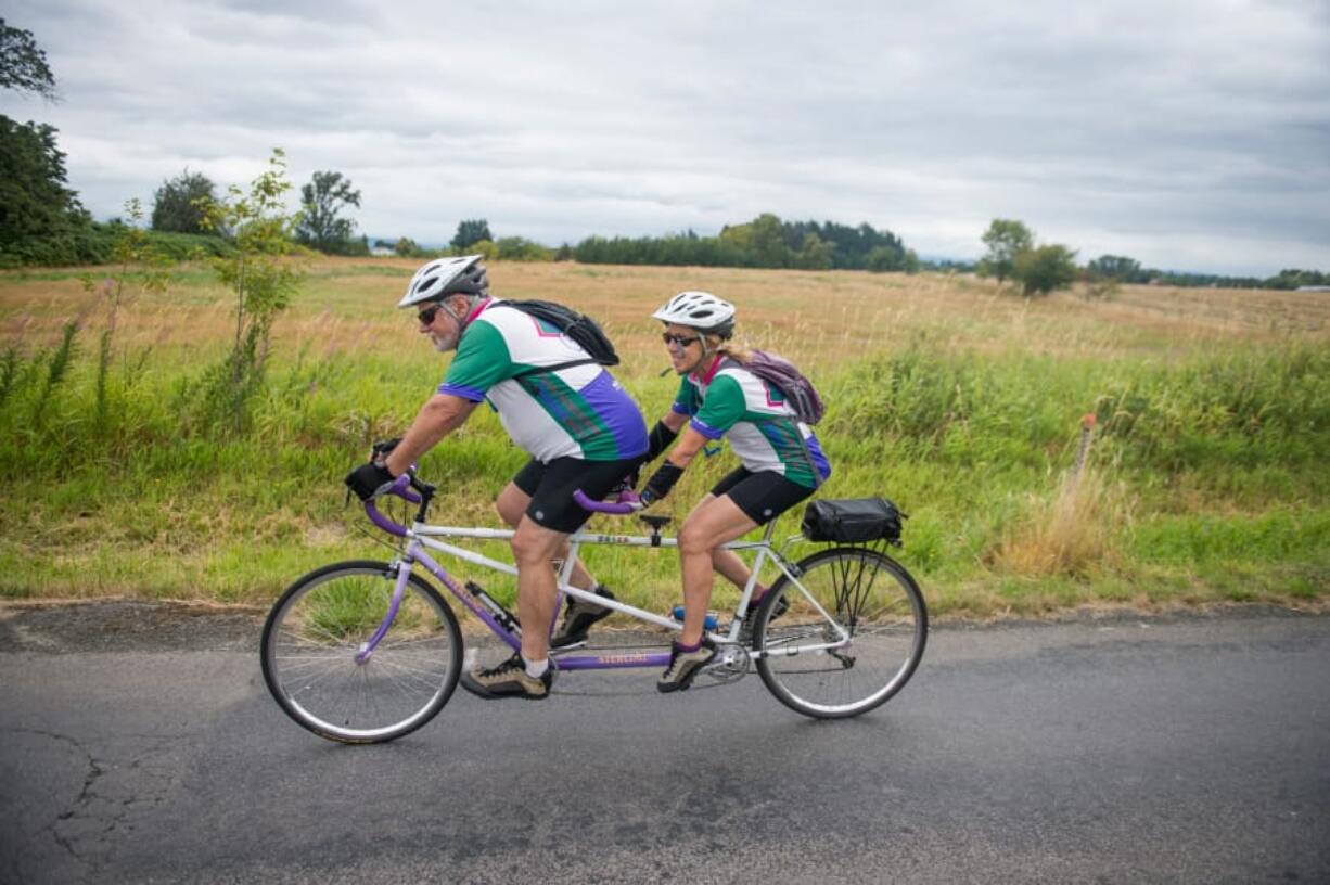 Paul and Liz Grun ride a tandem bicycle during Saturday’s Ride Around Clark County. The Vancouver Bicycle Club’s annual event allowed riders to select from five routes ranging from 20 to 100 miles.