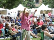 Willis Miller of Battle Ground feels the spirit of jazz in summertime during the 2013 Vancouver Wine and Jazz Festival in Esther Short Park.