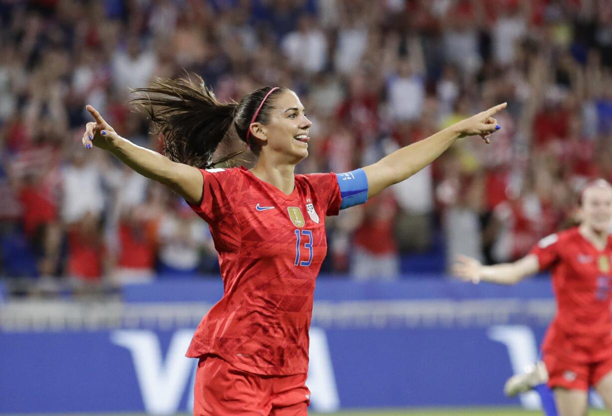 United States' Alex Morgan celebrates after scoring her side's second goal during the Women's World Cup semifinal soccer match between England and the United States, at the Stade de Lyon, outside Lyon, France, Tuesday, July 2, 2019.