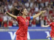 United States' Alex Morgan celebrates after scoring her side's second goal during the Women's World Cup semifinal soccer match between England and the United States, at the Stade de Lyon, outside Lyon, France, Tuesday, July 2, 2019.