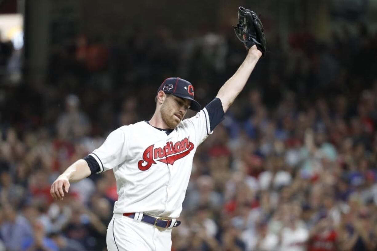 American League pitcher Shane Bieber, of the Cleveland Indians, reacts after striking out National League’s Ronald Acuna Jr., of the Atlanta Braves, to end the top of the fifth inning of the MLB baseball All-Star Game, Tuesday, July 9, 2019, in Cleveland.