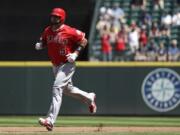 Los Angeles Angels' Albert Pujols rounds the bases on a solo home run against the Seattle Mariners in the second inning of a baseball game Sunday, July 21, 2019, in Seattle.