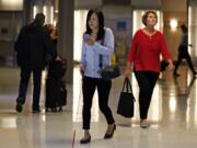 This June 9, 2019 photo shows Chieko Asakawa using the airport wayfinding app that she and her team at Carnegie Mellon University to navigate through Pittsburgh International Airside terminal in Imperial, Pa. before boarding a flight to Japan. (AP Photo/Gene J.