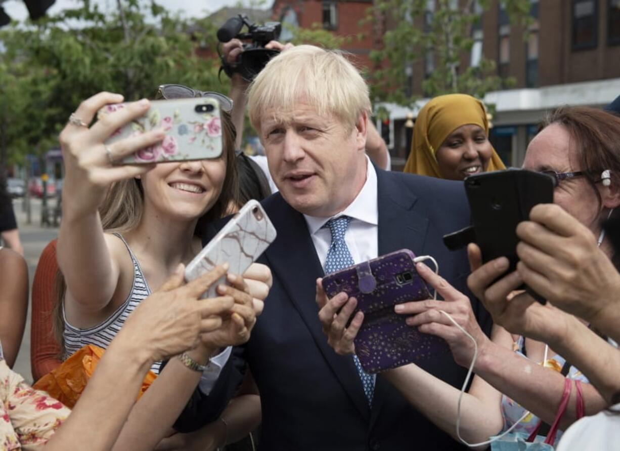 Britain’s Prime Minister Boris Johnson on a walkabout Friday during a visit to North Road, Birmingham, England.