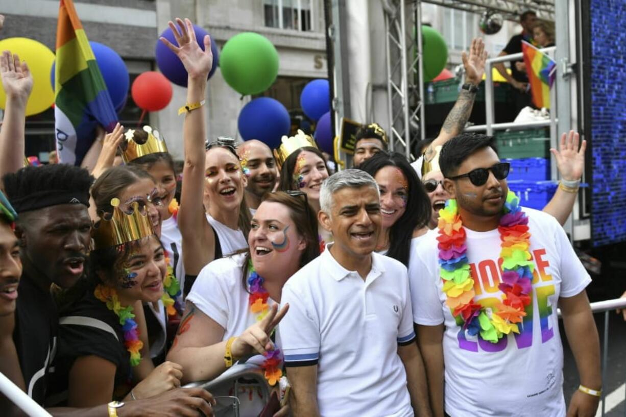 Mayor of London Sadiq Khan joins members of the crowd ahead of the Pride in London Parade in central London, Saturday, July 6, 2019.