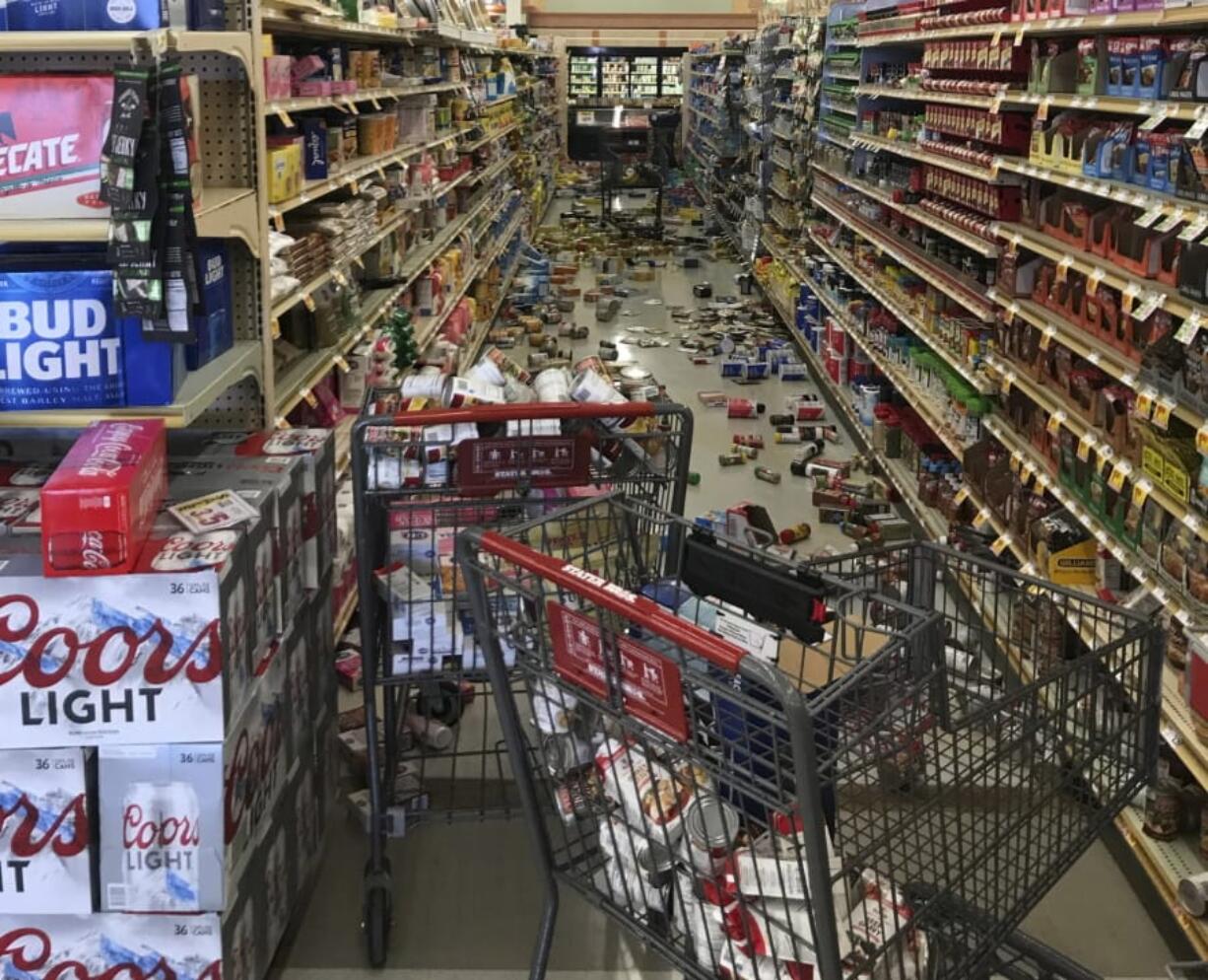 In this photo provided by Adam Graehl, food and other merchandise lies on the floor at the Stater Bros. on China Lake Blvd., after an earthquake, Thursday, July 4, 2019, in Ridgecrest, Calif. The strongest earthquake in 20 years shook a large swath of Southern California and parts of Nevada on Thursday, rattling nerves on the July 4th holiday and causing injuries and damage in a town near the epicenter, followed by a swarm of ongoing aftershocks.