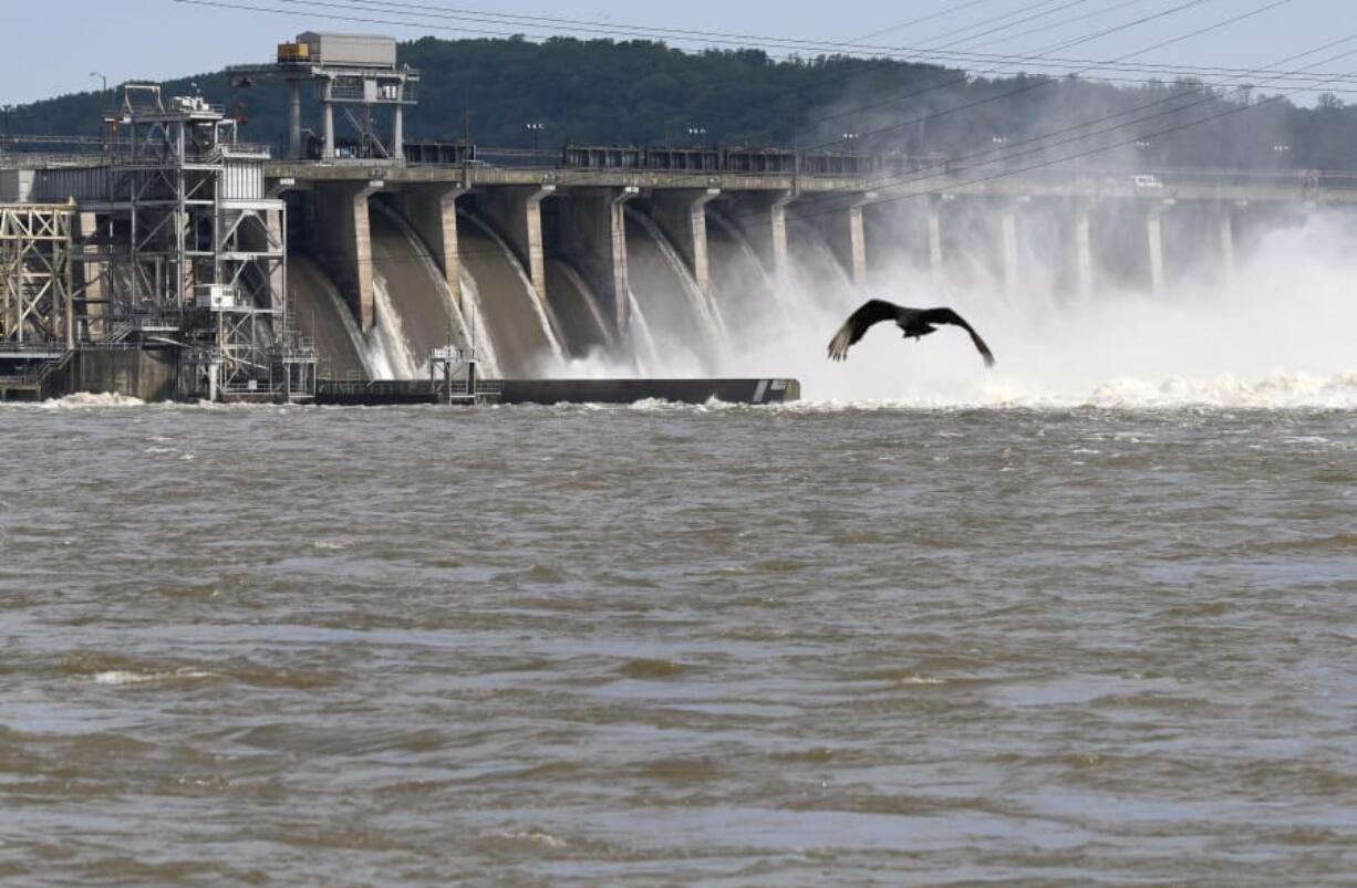 Water flows through Conowingo Dam, a hydroelectric dam spanning the lower Susquehanna River near Conowingo, Md., on Thursday, May 16, 2019. Officials once counted on the dam to block large amounts of sediment in the Susquehanna from reaching Chesapeake Bay, the nation’s largest estuary, but the reservoir behind the dam has filled with sediment far sooner than expected.